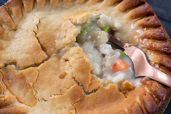 Closeup Of Golden Brown Chicken Pot Pie With Vegetables Flat Lay
