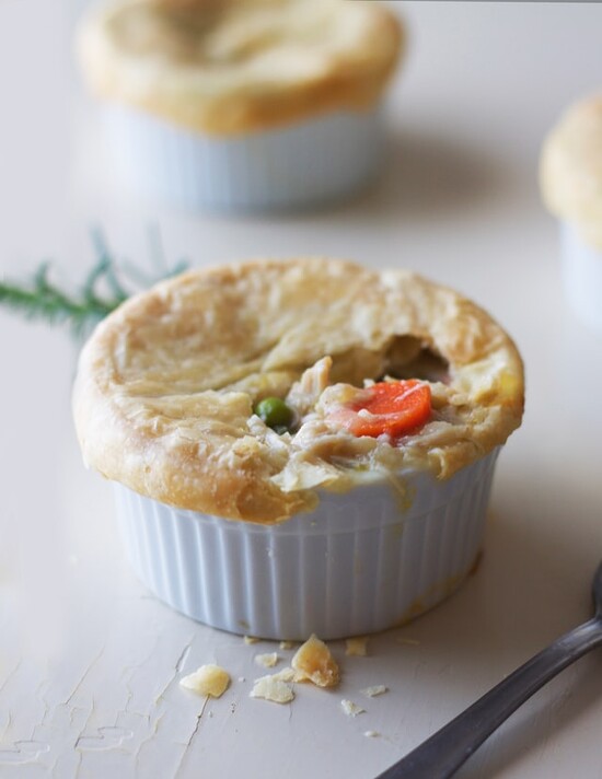 Golden-brown chicken pot pie in a ramekin, showcasing a hearty, comforting filling.