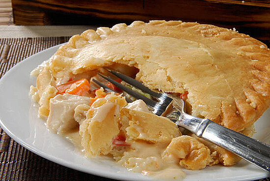 A Hot Chicken Pot Pie Broken Open With A Fork